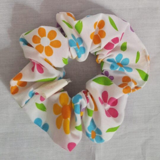 White scrunchie with multicoloured flowers